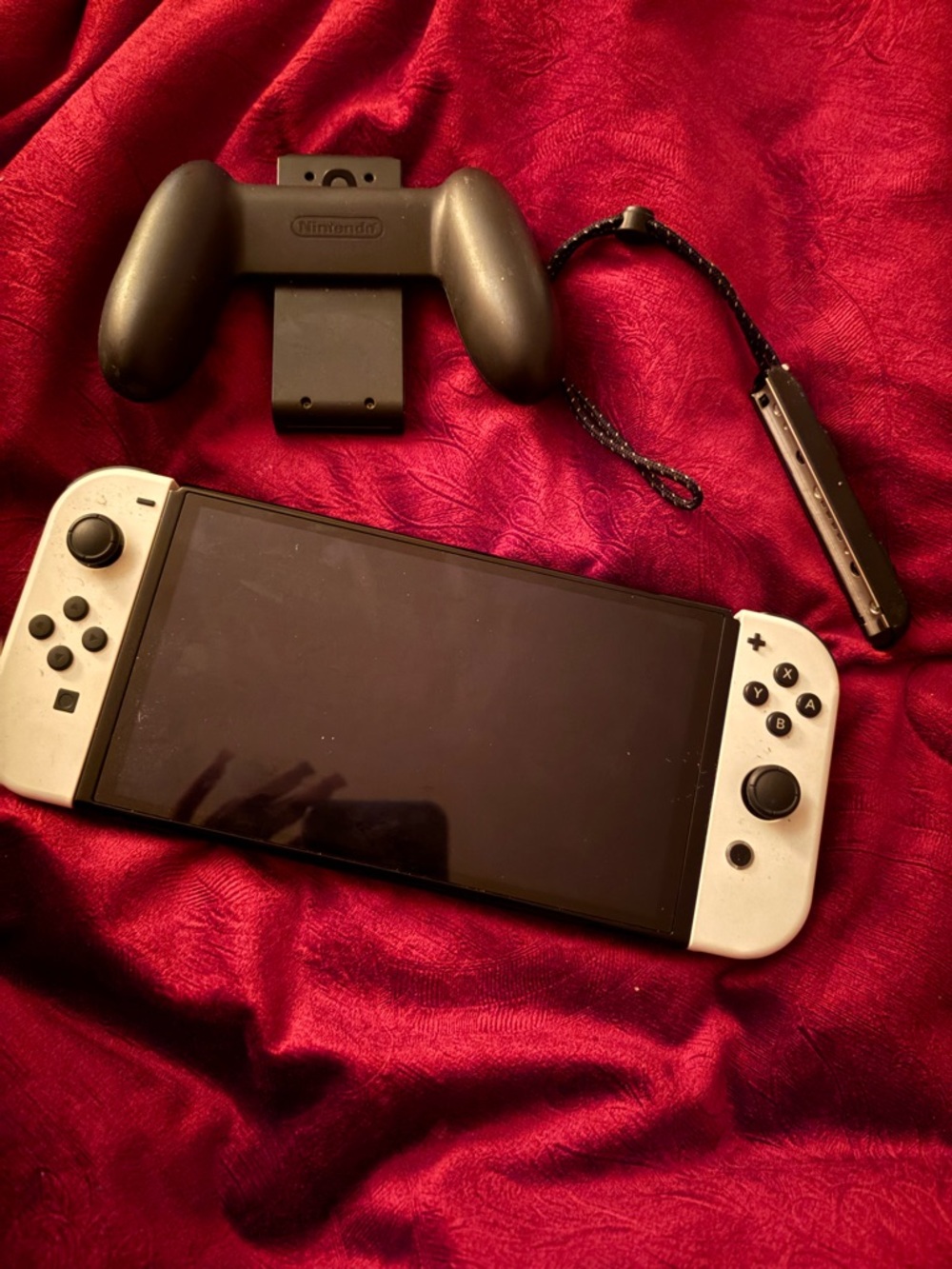 Nintendo Switch OLED with White Joy-Con and Black Accessories